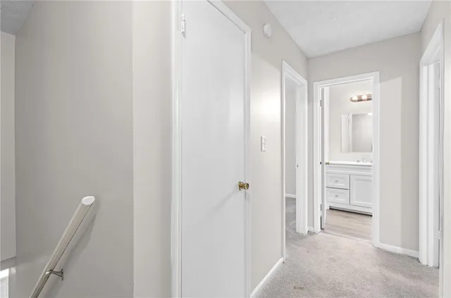 a view of a bathroom from a hallway