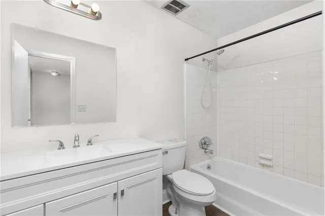 a bathroom with a sink a toilet and a bathtub