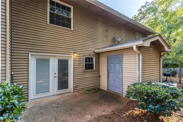 a view of a house with a yard and garage