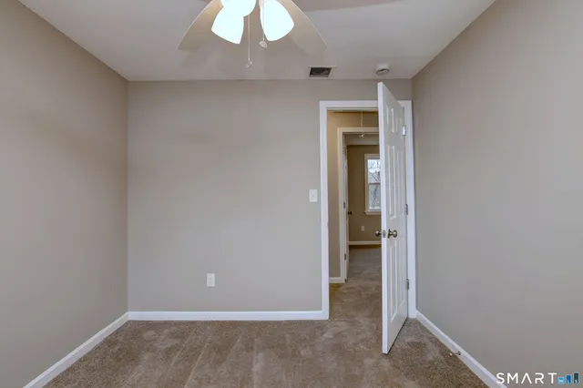 an empty room with a bathroom