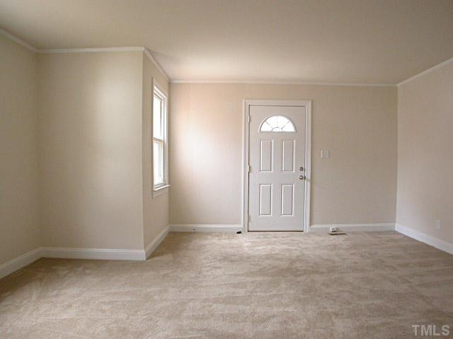 2115 Milburnie Road Raleigh, NC 27610 - Photo 8 of 15 an empty room with windows and mirror
