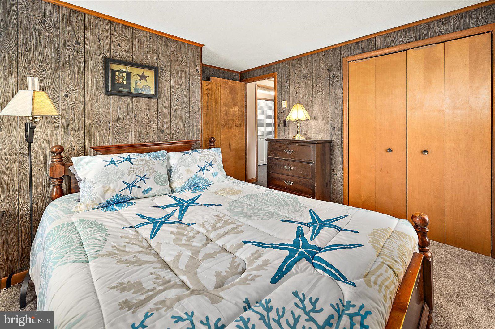 5241 Frances Road Marion Station, MD 21838 - Photo 113 of 146 a bedroom with a bed and a lamp