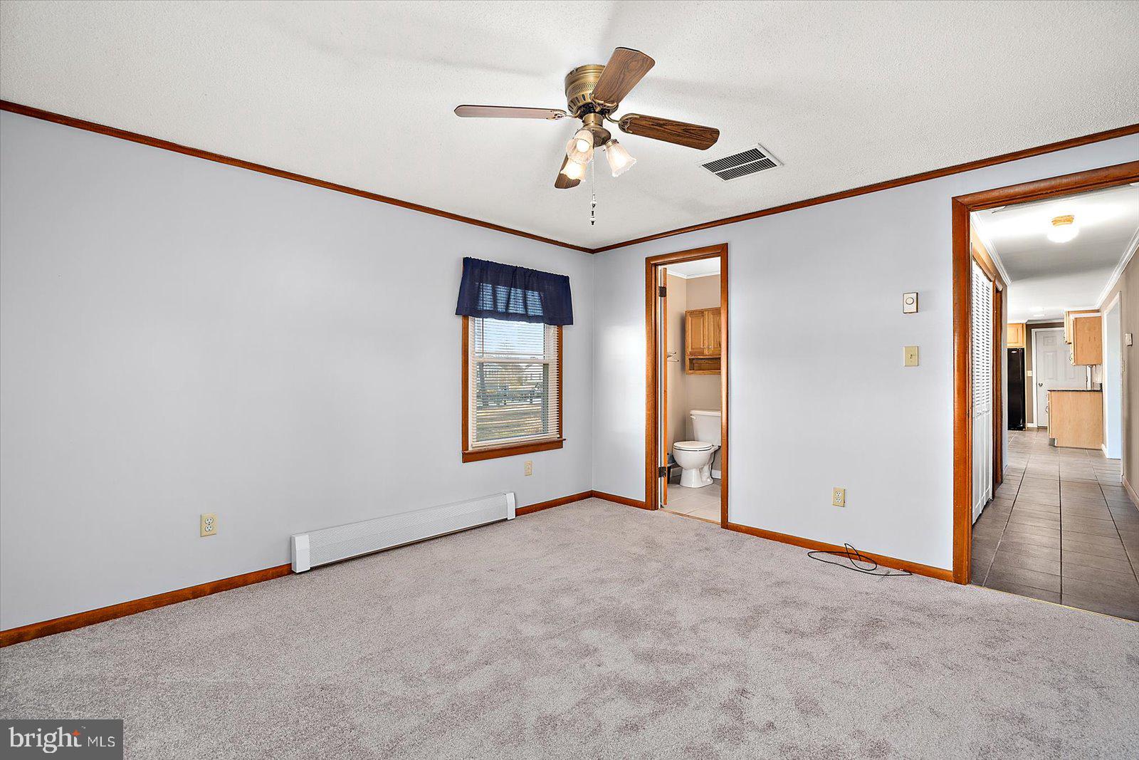 5241 Frances Road Marion Station, MD 21838 - Photo 120 of 146 a view of a livingroom with a ceiling fan and window