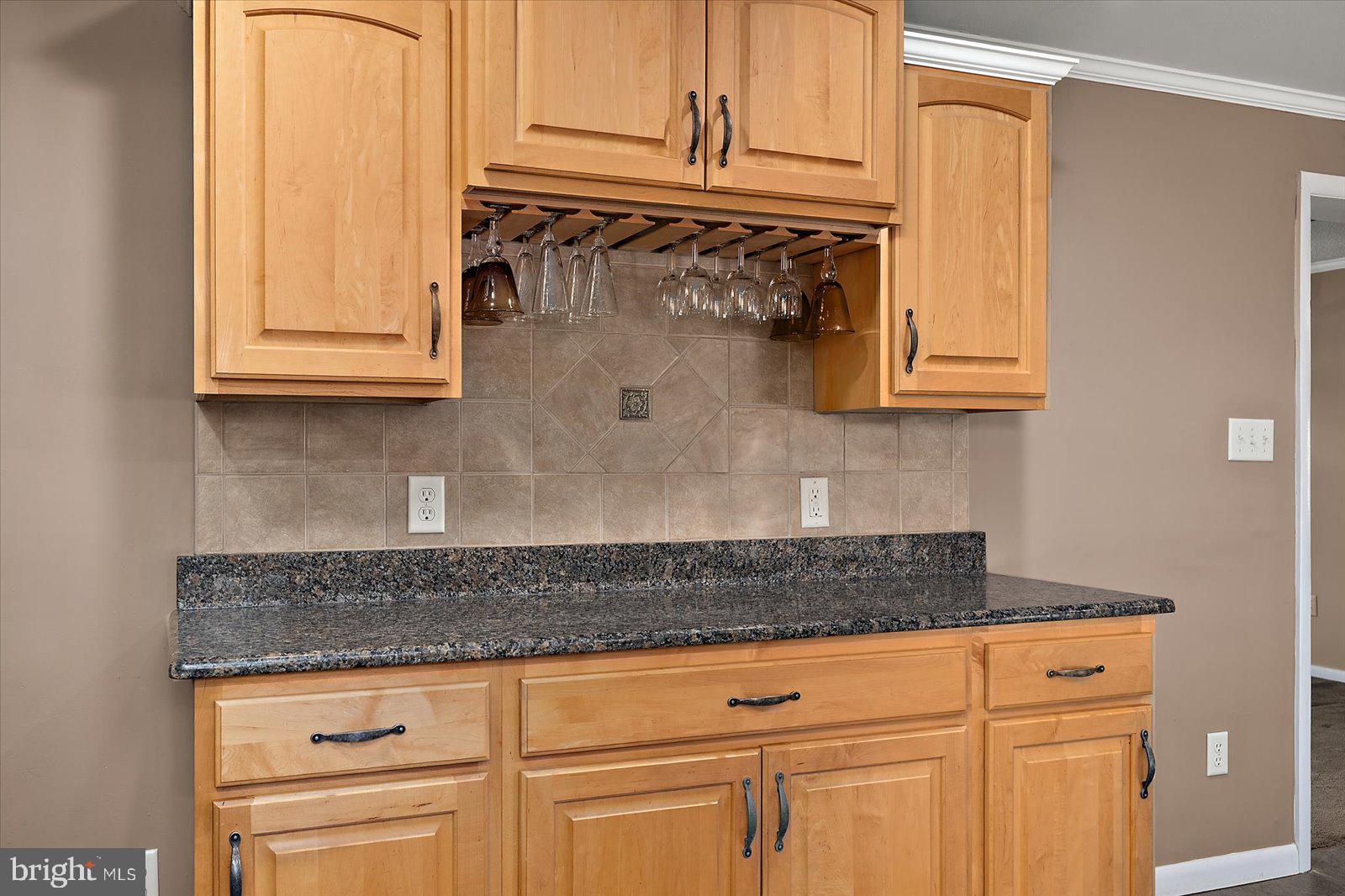 5241 Frances Road Marion Station, MD 21838 - Photo 122 of 146 a kitchen with granite countertop white cabinets and a granite counter tops