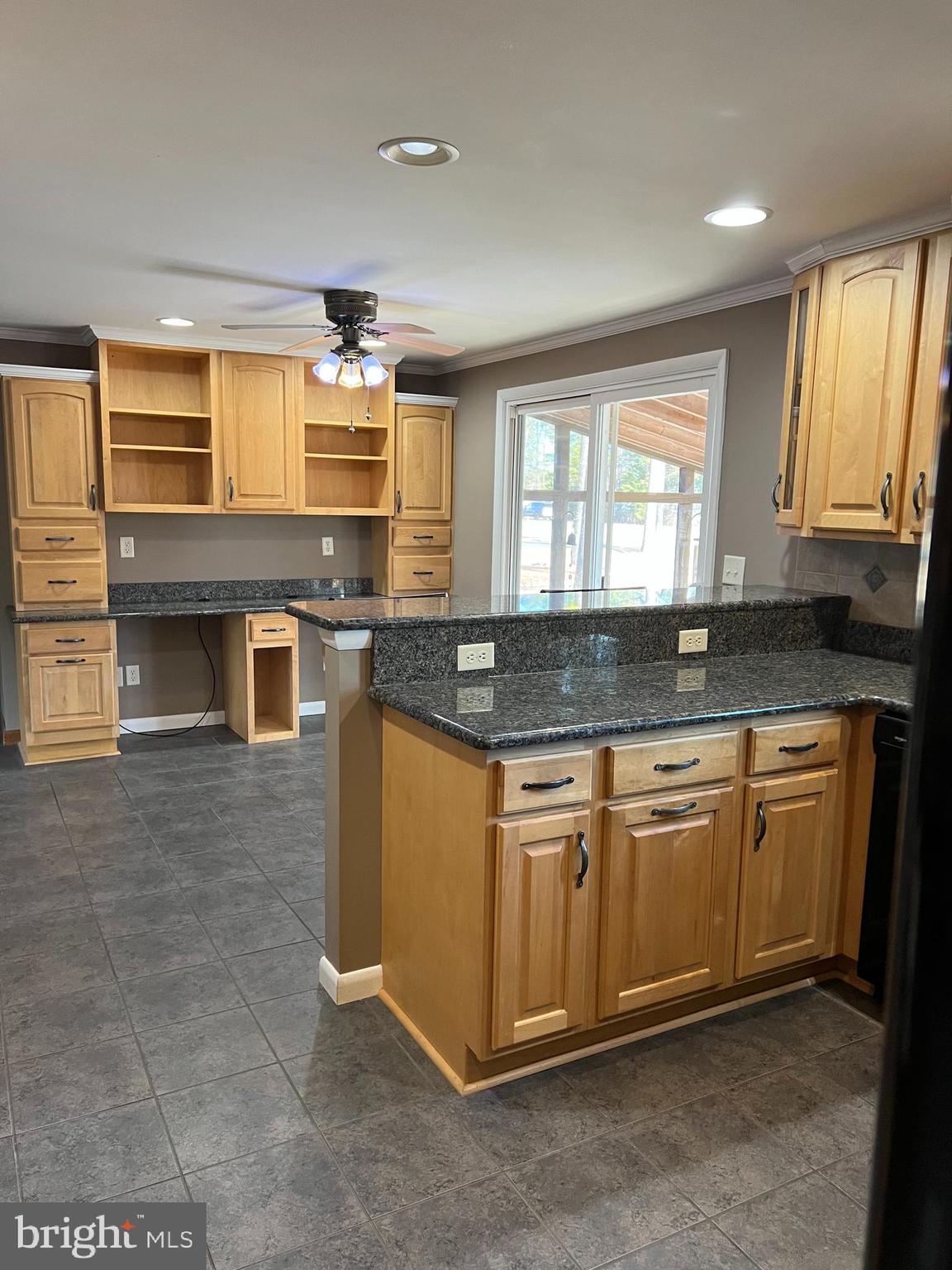 5241 Frances Road Marion Station, MD 21838 - Photo 20 of 146 a kitchen with granite countertop a sink stove and cabinets