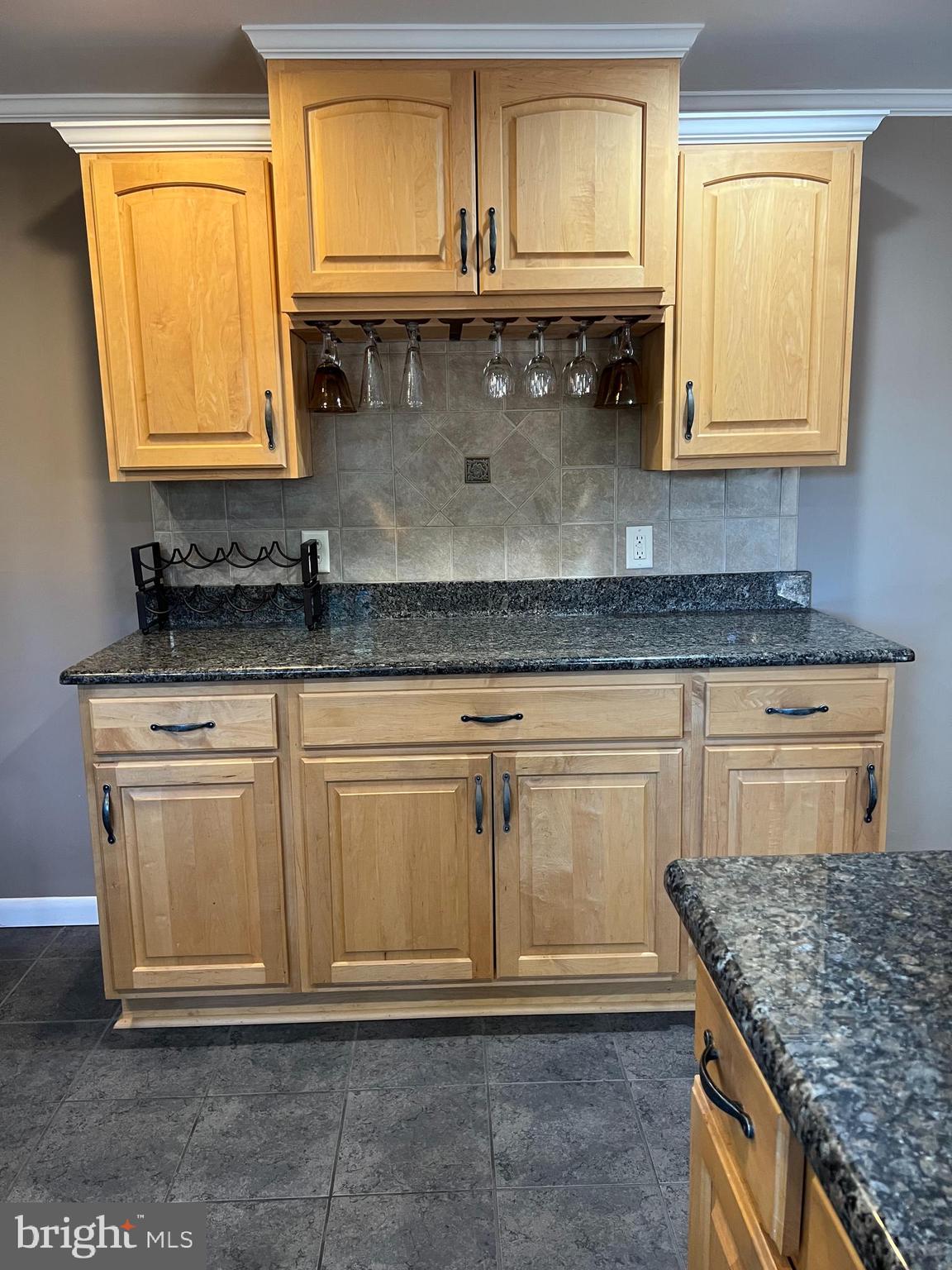 5241 Frances Road Marion Station, MD 21838 - Photo 22 of 146 a kitchen with granite countertop a sink and a white wooden cabinets