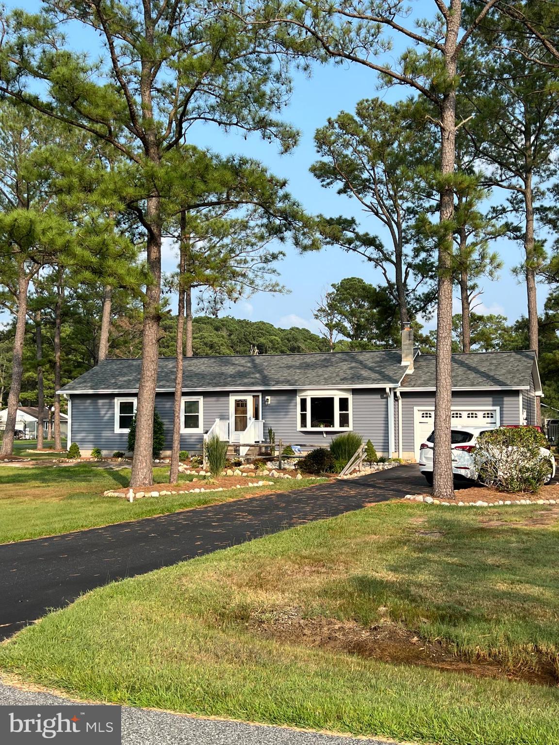 5241 Frances Road Marion Station, MD 21838 - Photo 3 of 146 a front view of a house with swimming pool and outdoor seating