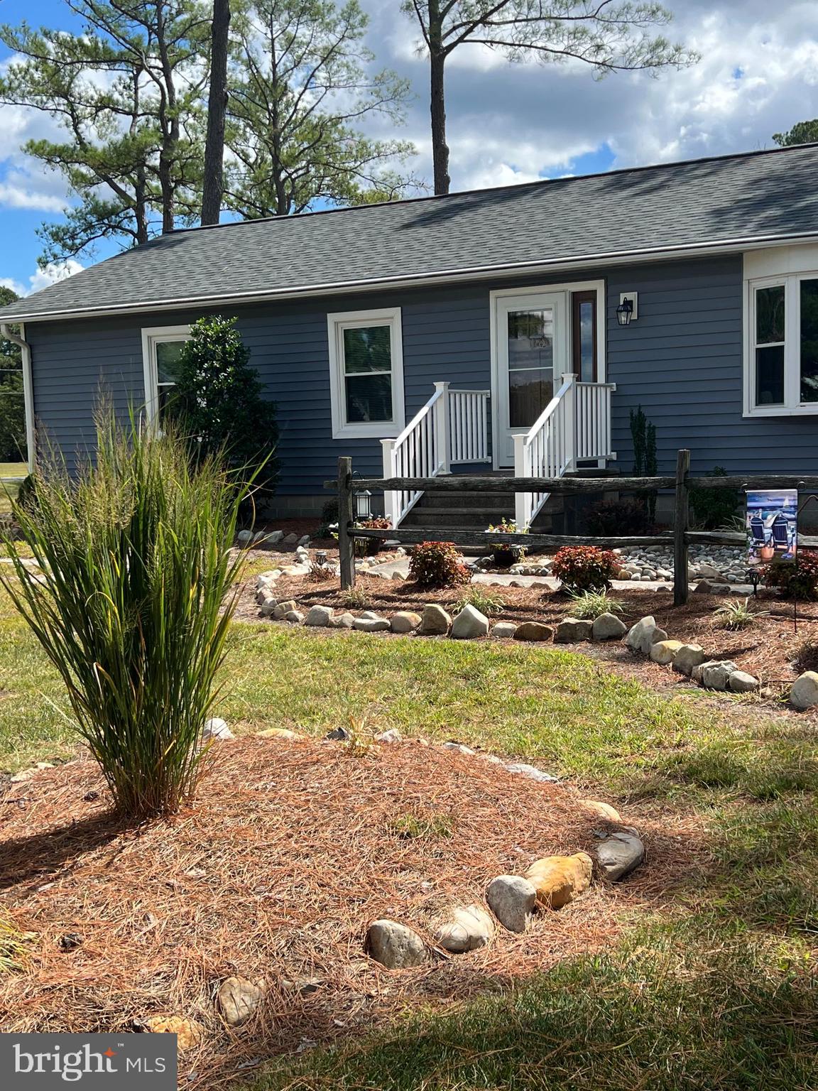 5241 Frances Road Marion Station, MD 21838 - Photo 4 of 146 a backyard of a house with yard and outdoor seating