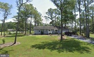5241 Frances Road Marion Station, MD 21838 - Photo 44 of 146 a view of a backyard with a garden and trees