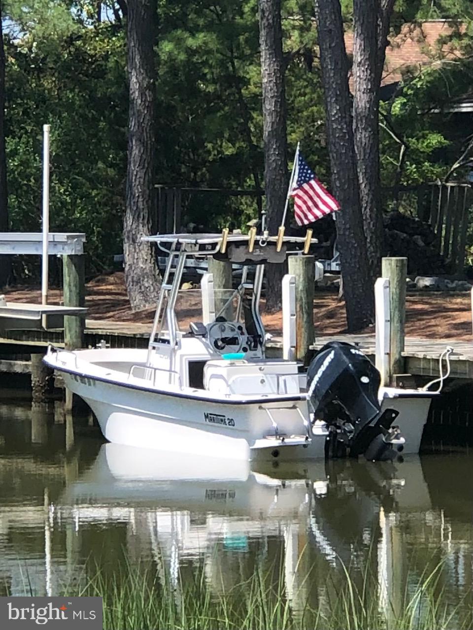 5241 Frances Road Marion Station, MD 21838 - Photo 48 of 146 a view of a lake with a house and outdoor space