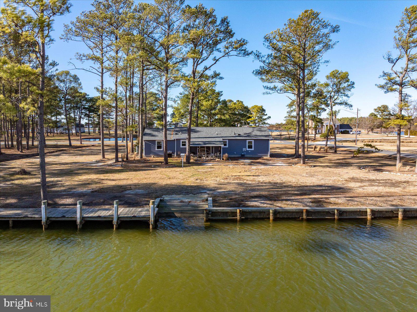 5241 Frances Road Marion Station, MD 21838 - Photo 56 of 146 a view of swimming pool with outdoor seating and lake view