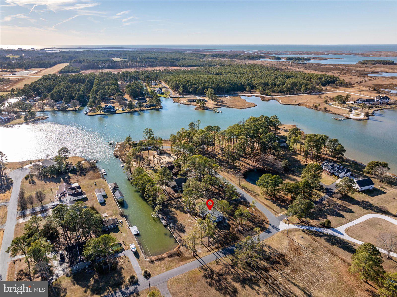 5241 Frances Road Marion Station, MD 21838 - Photo 75 of 146 an aerial view of city and lake with trees all around