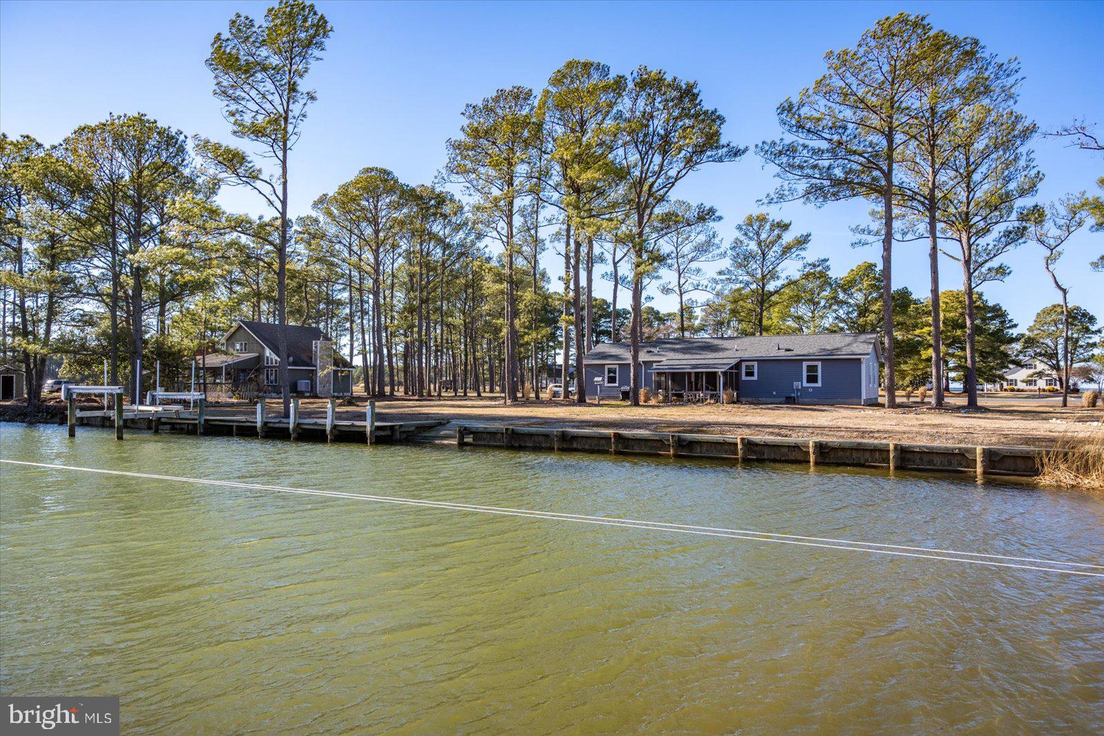 5241 Frances Road Marion Station, MD 21838 - Photo 77 of 146 a view of a swimming pool with outdoor seating and a tree