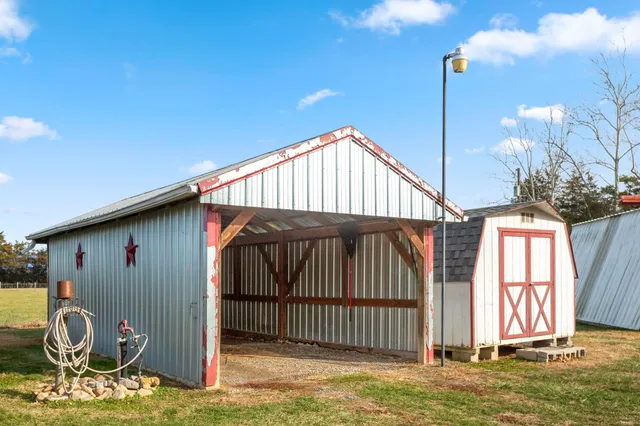 a kitchen with a refrigerator a stove a sink and white cabinets