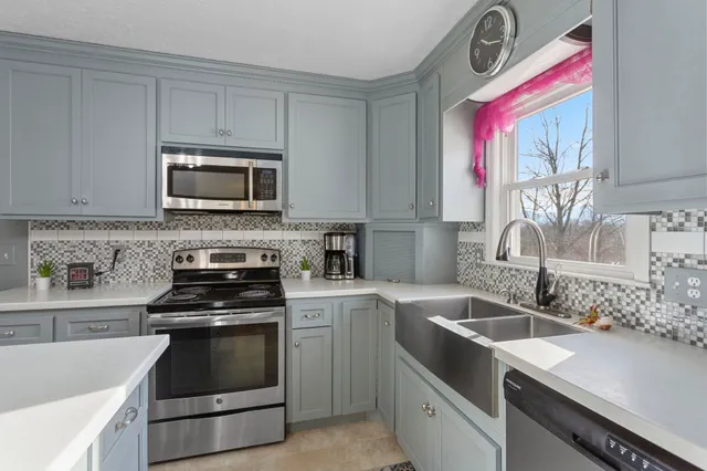 a view of a workspace with furniture and a workspace