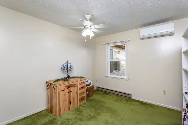 a bathroom with a toilet sink vanity and mirror