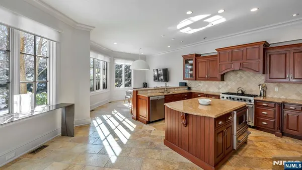 a kitchen with a stove top oven sink and cabinets