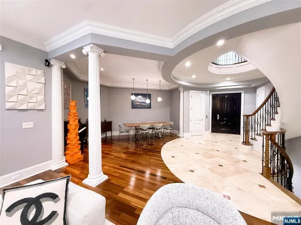 a living room with furniture and a chandelier