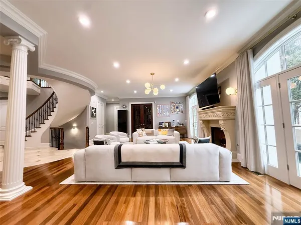 a living room with fireplace furniture and a flat screen tv