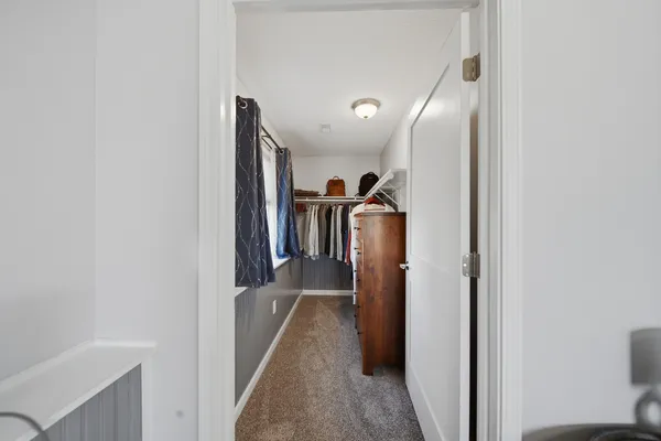 a view of hallway with furniture