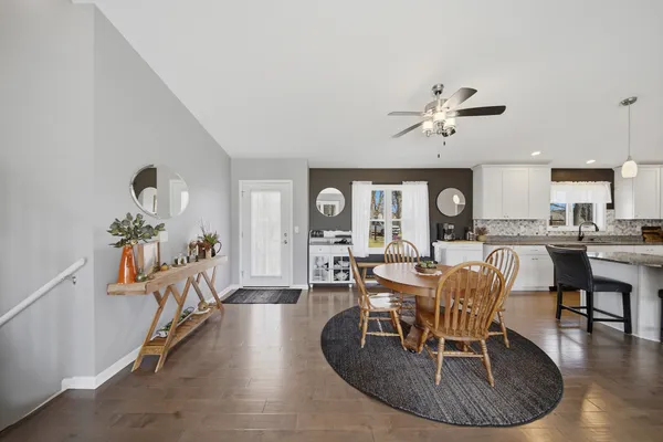 a view of a dining room with furniture window and wooden floor