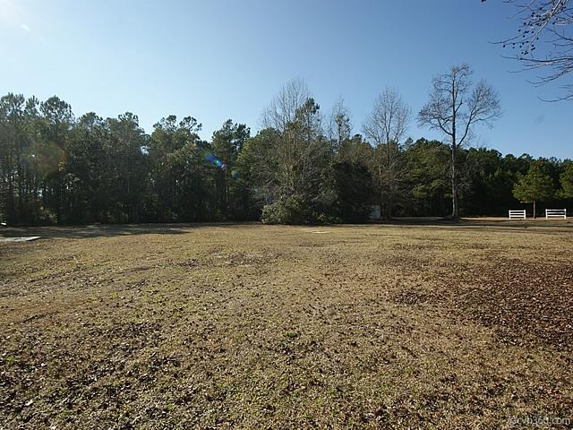 877 Lyon Road Awendaw, SC 29429 - Photo 27 of 30 property backs up to wooded buffer