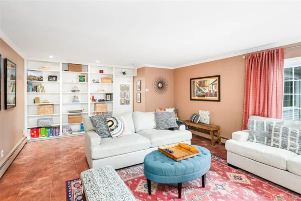 a living room with furniture and a rug