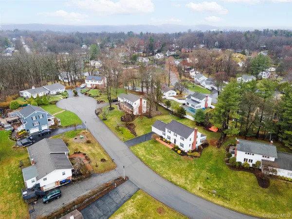 an aerial view of a house with a swimming pool yard and outdoor seating
