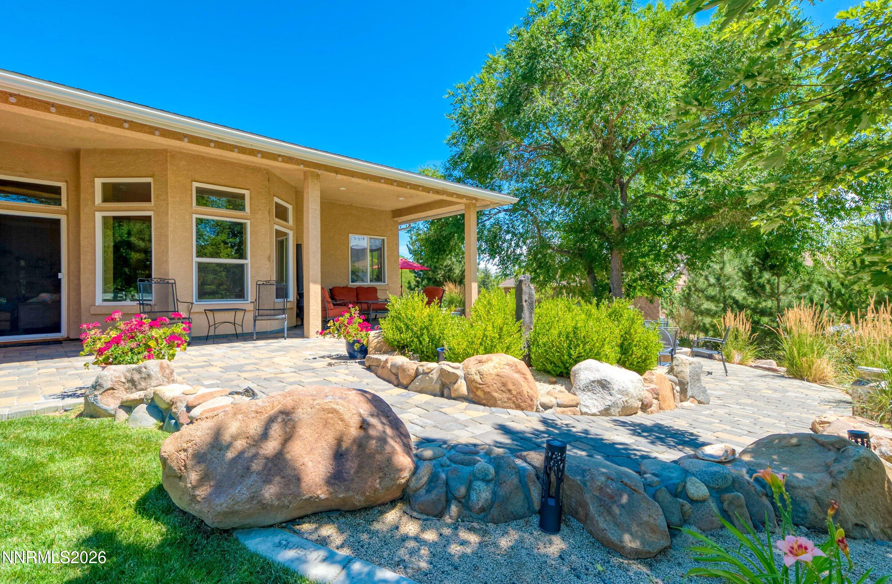 310 Kitts Way Reno, NV 89521 - Photo 57 of 114 a view of a house with backyard porch and sitting area