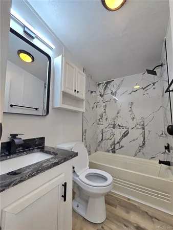 a bathroom with a toilet and a sink