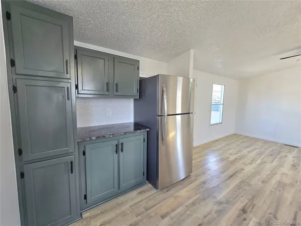 a kitchen with stainless steel appliances a refrigerator and a sink