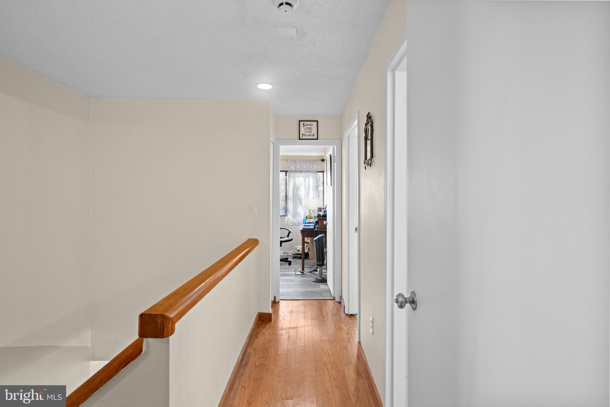 2363 Nutmeg Terrace Baltimore, MD 21209 - Photo 11 of 29 a view of a hallway with wooden floor and staircase