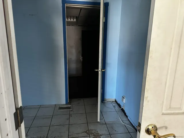 a view of an entryway and livingroom