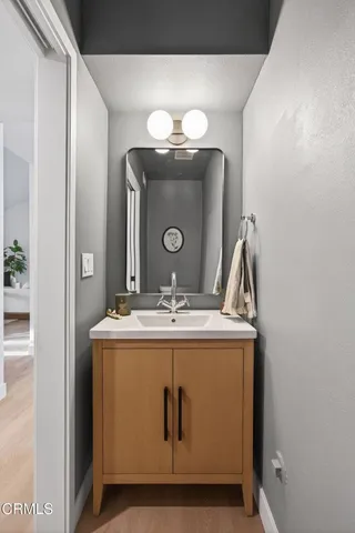 a bathroom with a shower sink mirror and toilet