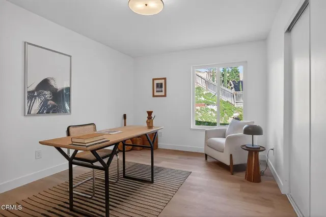 an aerial view of a house with a yard basket ball court and outdoor seating