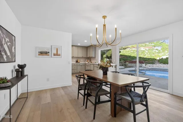 a view of a dining room with furniture window and outside view
