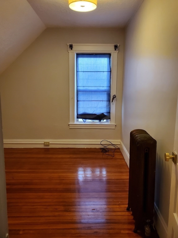 25 Kimberly Avenue, Unit 2 Springfield, MA 01108 - Photo 18 of 19 a view of a room with wooden floor and a chair