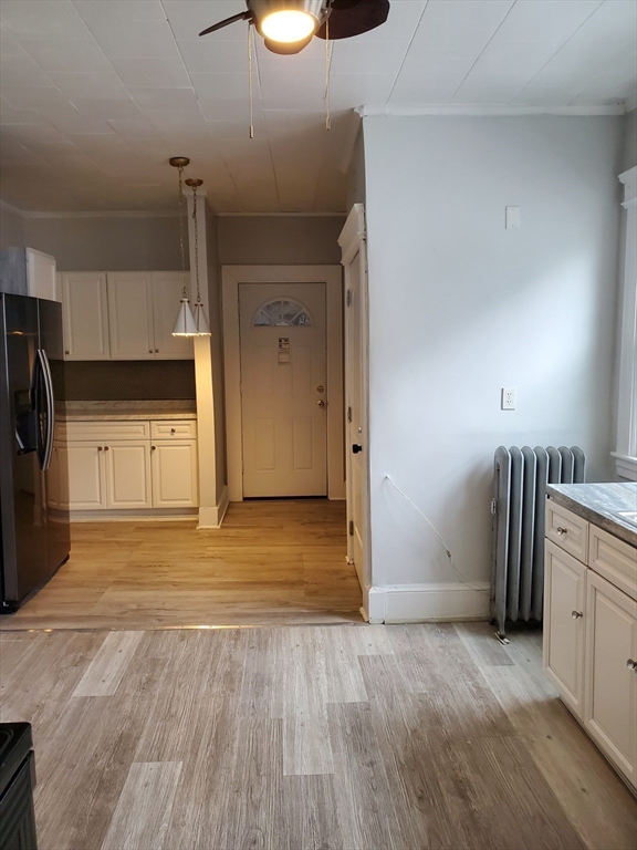 25 Kimberly Avenue, Unit 2 Springfield, MA 01108 - Photo 2 of 19 a view of a kitchen with a sink and a refrigerator