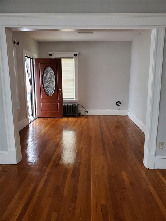 25 Kimberly Avenue, Unit 2 Springfield, MA 01108 - Photo 7 of 19 a view of a hallway with wooden floor