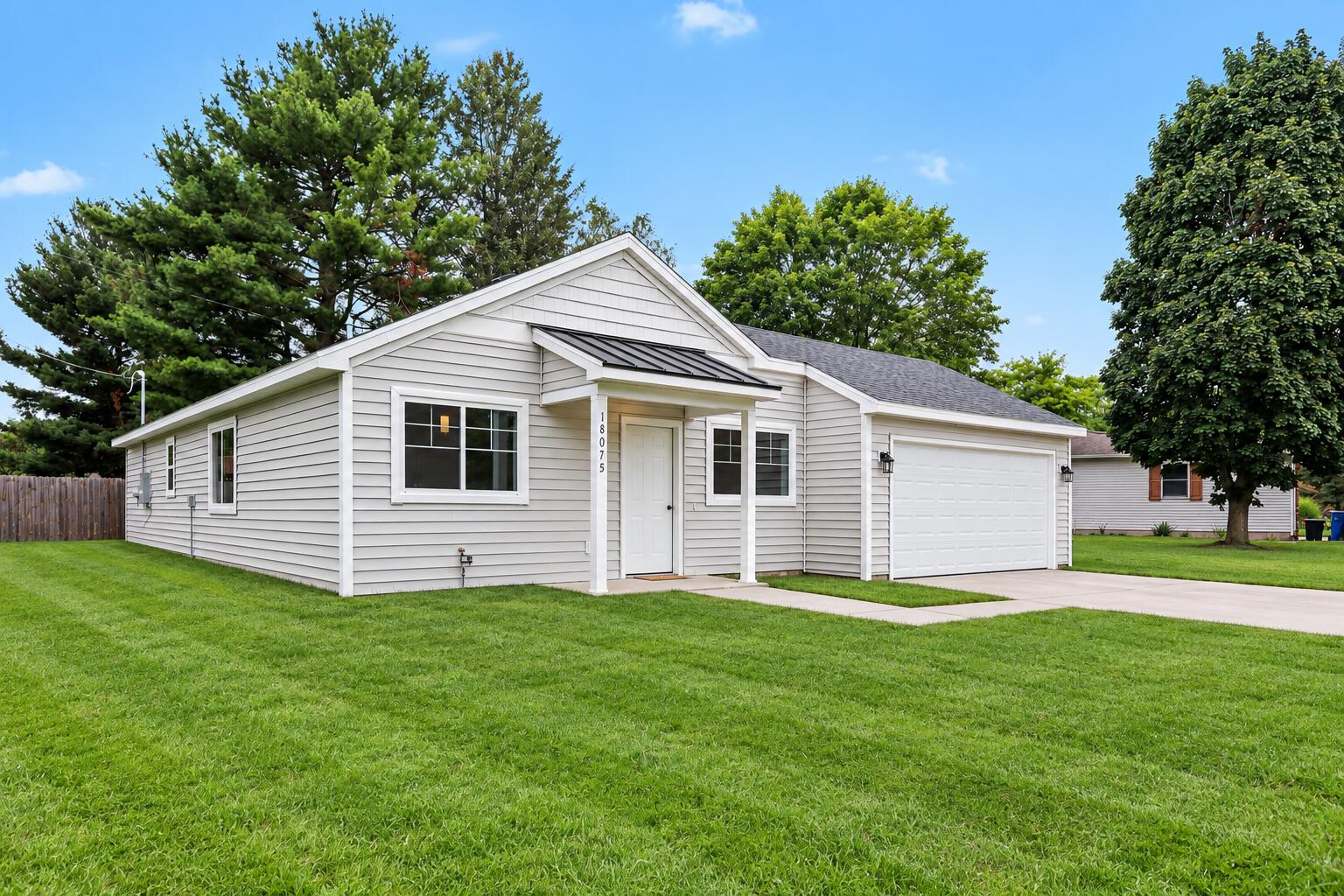 859 Merrick Street Belding, MI 48809 - Photo 2 of 14 AI edited grass-side