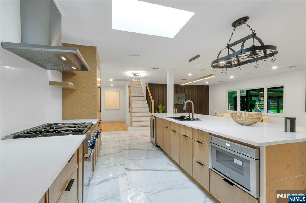 14 Rambling Brook Road Upper Saddle River, NJ 07458 - Photo 13 of 40 a kitchen with stove and cabinets