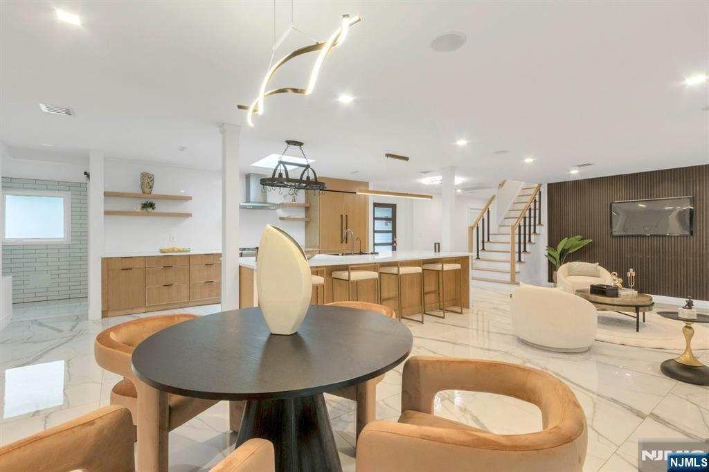 14 Rambling Brook Road Upper Saddle River, NJ 07458 - Photo 14 of 40 a dining room with furniture a large window and kitchen view
