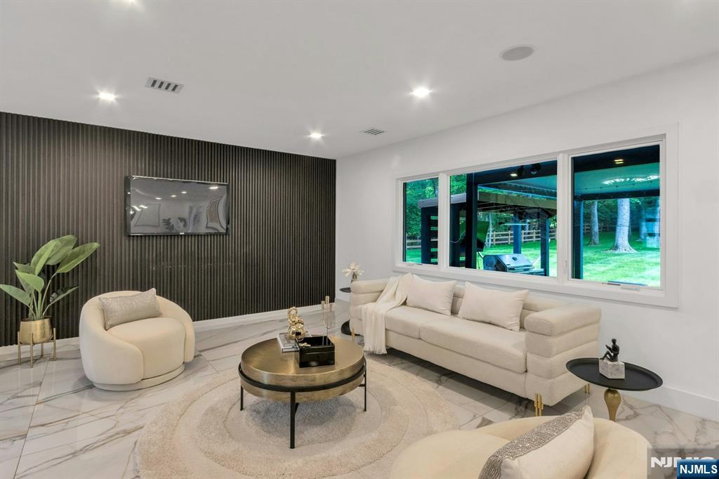 14 Rambling Brook Road Upper Saddle River, NJ 07458 - Photo 15 of 40 a living room with furniture and a large window