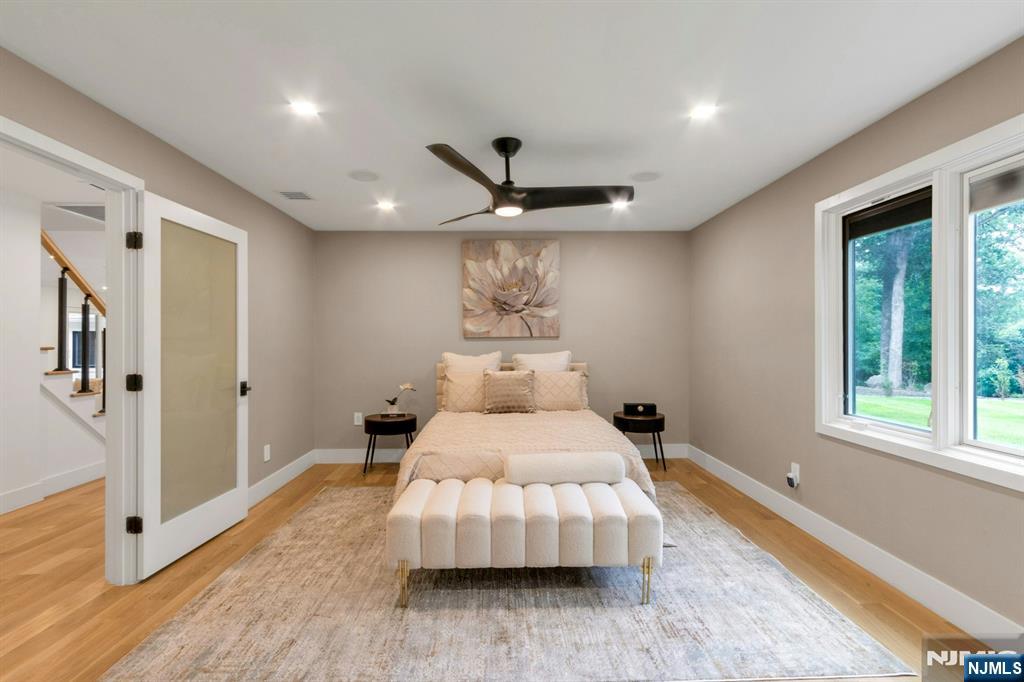 14 Rambling Brook Road Upper Saddle River, NJ 07458 - Photo 20 of 40 a bed room with a bed and a large window