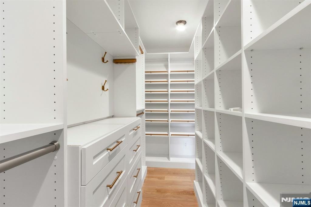 14 Rambling Brook Road Upper Saddle River, NJ 07458 - Photo 23 of 40 a view of walk in closet with empty racks