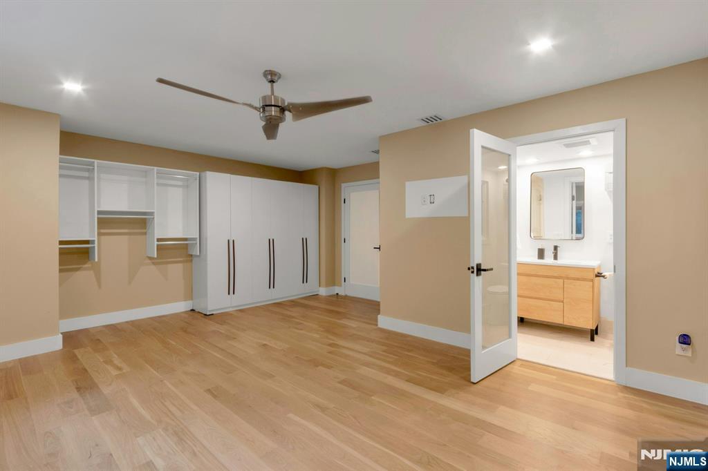 14 Rambling Brook Road Upper Saddle River, NJ 07458 - Photo 25 of 40 a view of empty room with wooden floor and cabinet