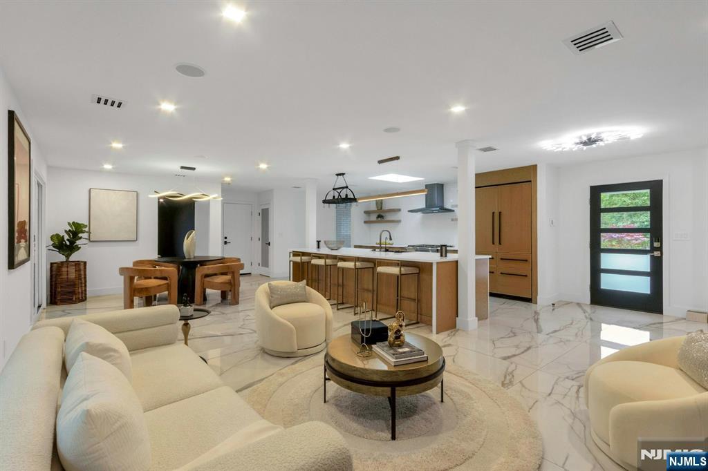 14 Rambling Brook Road Upper Saddle River, NJ 07458 - Photo 3 of 40 a living room with furniture and a view of kitchen