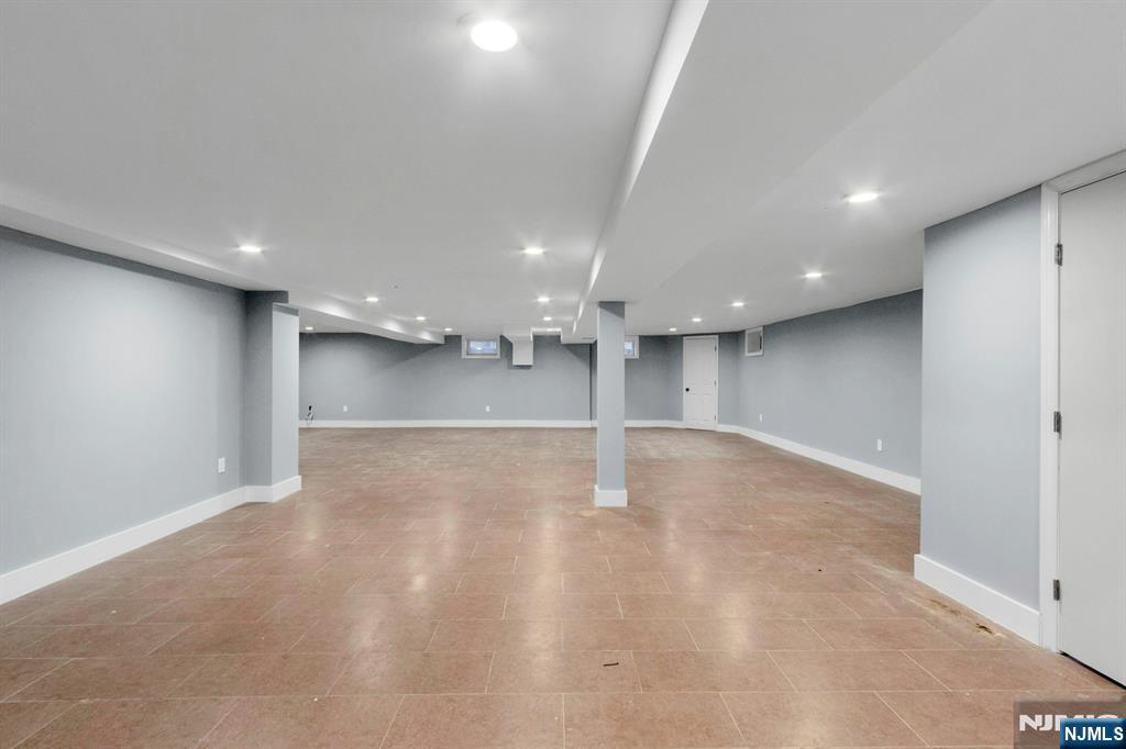 14 Rambling Brook Road Upper Saddle River, NJ 07458 - Photo 33 of 40 an empty room with wooden floor