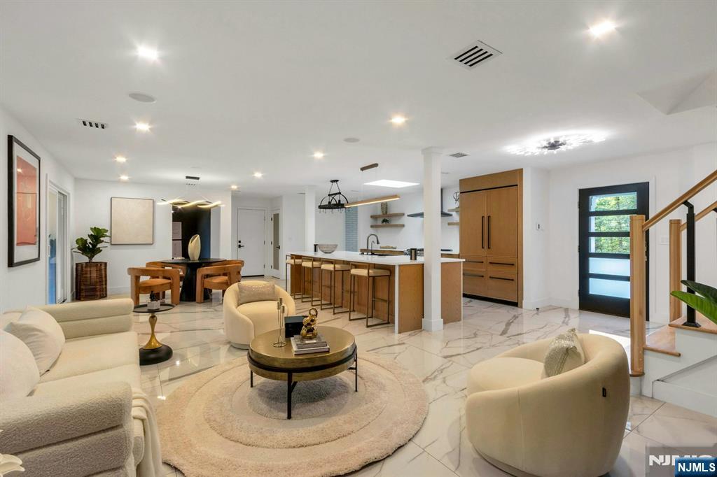 14 Rambling Brook Road Upper Saddle River, NJ 07458 - Photo 5 of 40 a living room with furniture and a kitchen view