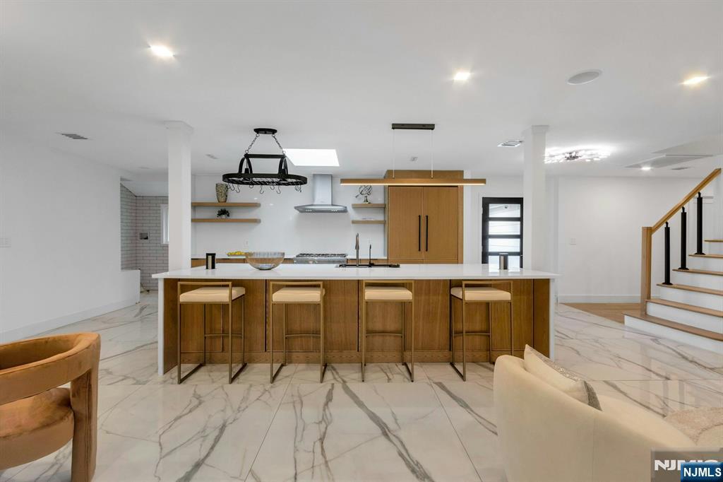 14 Rambling Brook Road Upper Saddle River, NJ 07458 - Photo 6 of 40 a kitchen with table chairs and refrigerator